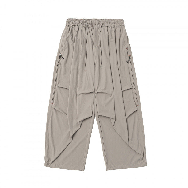 Unisex Loose-fitting technical cargo pants with elastic waistband, drawstring, and zip pockets Shop Velvia