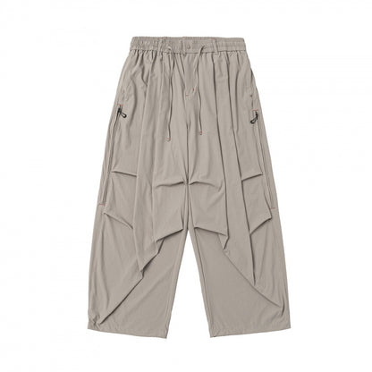 Unisex Loose-fitting technical cargo pants with elastic waistband, drawstring, and zip pockets Shop Velvia